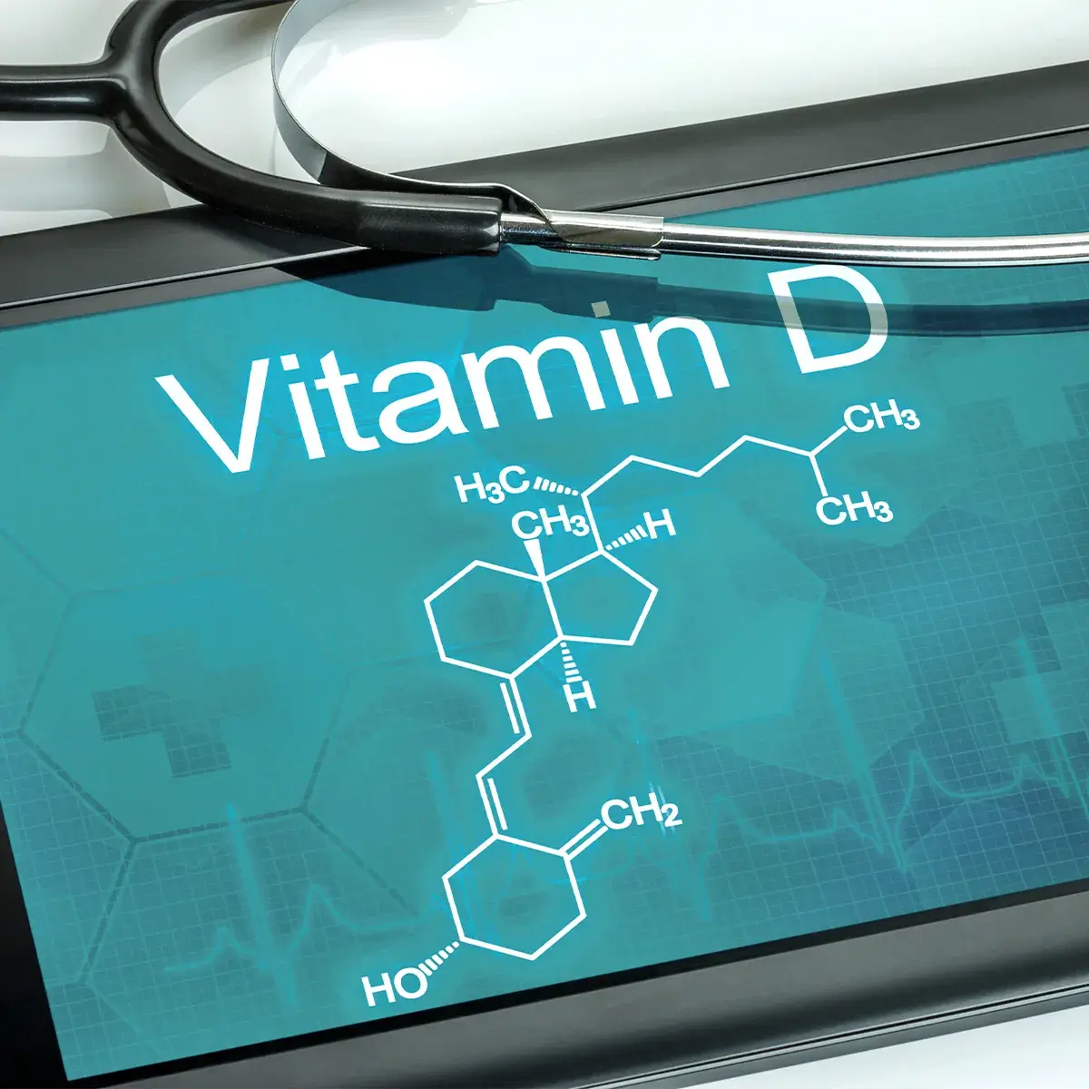 Bedeutung von Vitamin D Stärkung Immunsystem Vitamin D Molekül auf einem Pad mit einem Teil eine Stetoskop drüber